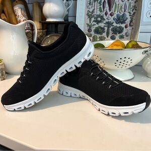 Skechers Women’s Black Knit Slip-On Athletic Sneakers with White Sole